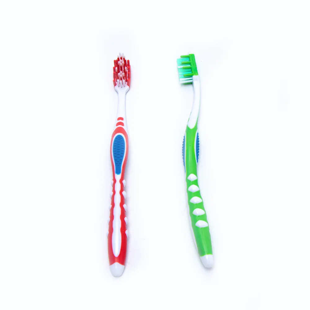 Innovative manual fat handle gum massage feature adult toothbrush with silicone