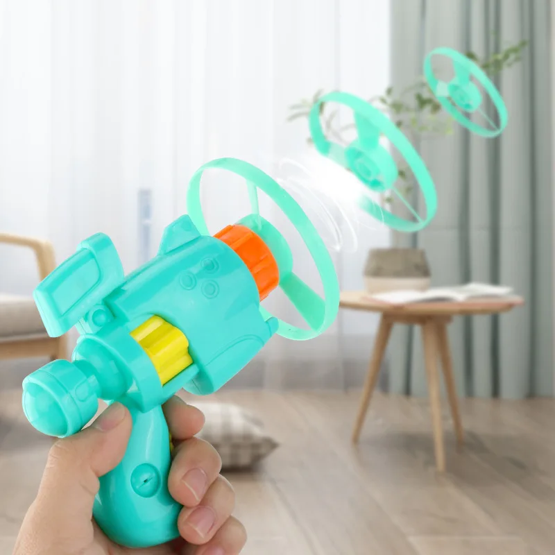 HY Toys dragonfly flying saucer light pistol Flying Fairy outdoor ejection spinning cross border toys for childre