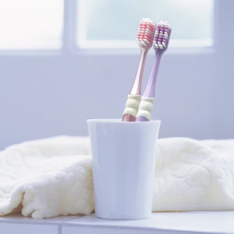 Factory wholesale custom logo shaped hole bristles plastic adult toothbrush