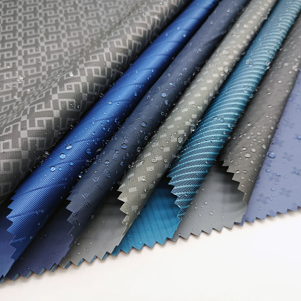 Wholesale 100% polyester waterproof raincoat fabric with PVC coated jacquard water proof poncho fabric