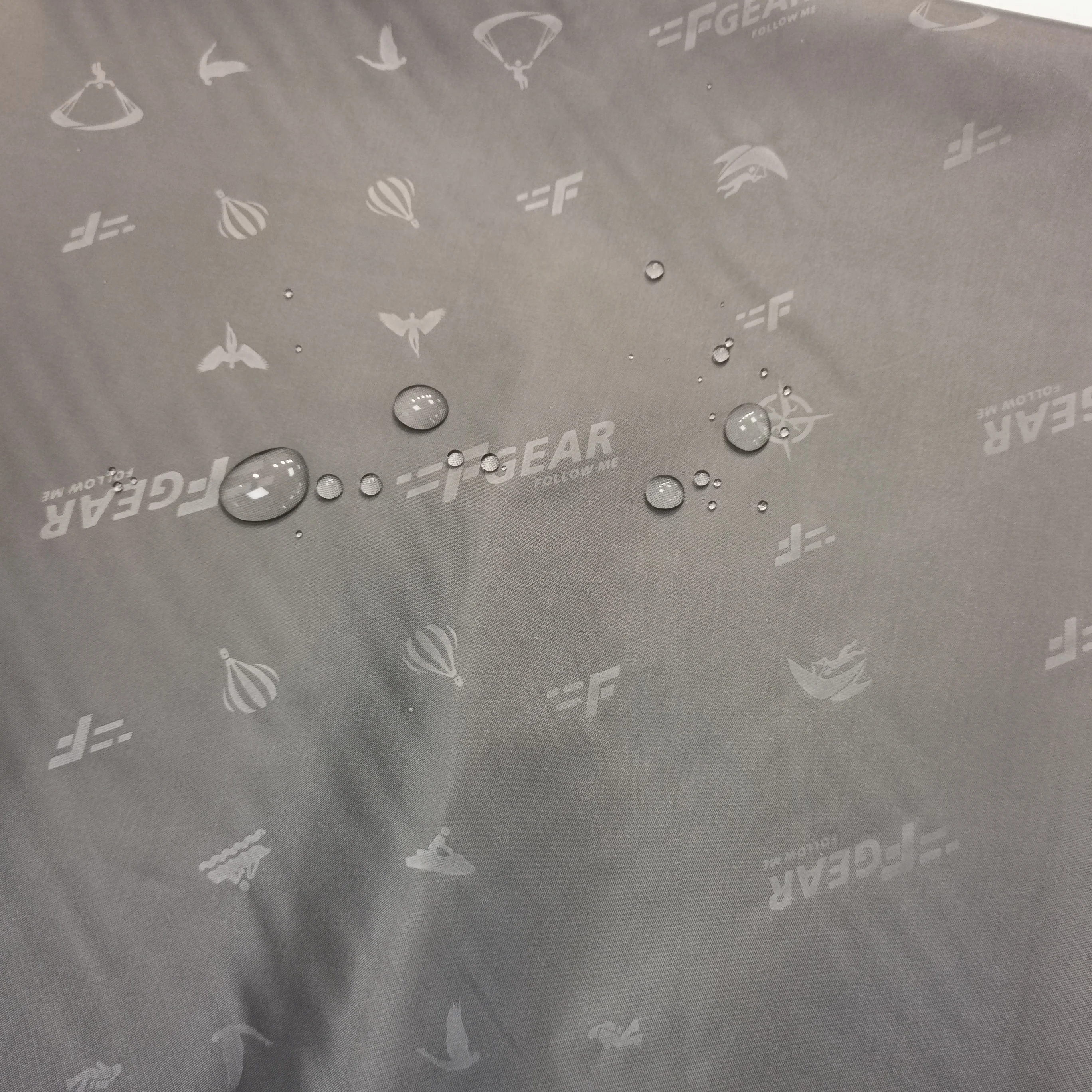 High quality woven jersey polyester jacquard with twill taffeta embossed red-crowned crane logo jacquard lining