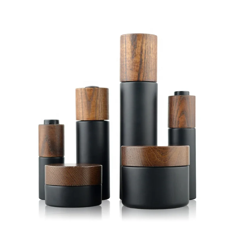 Elegant Matte black glass cosmetic bottles cream jars  with ash wooden lids for cosmetic packaging