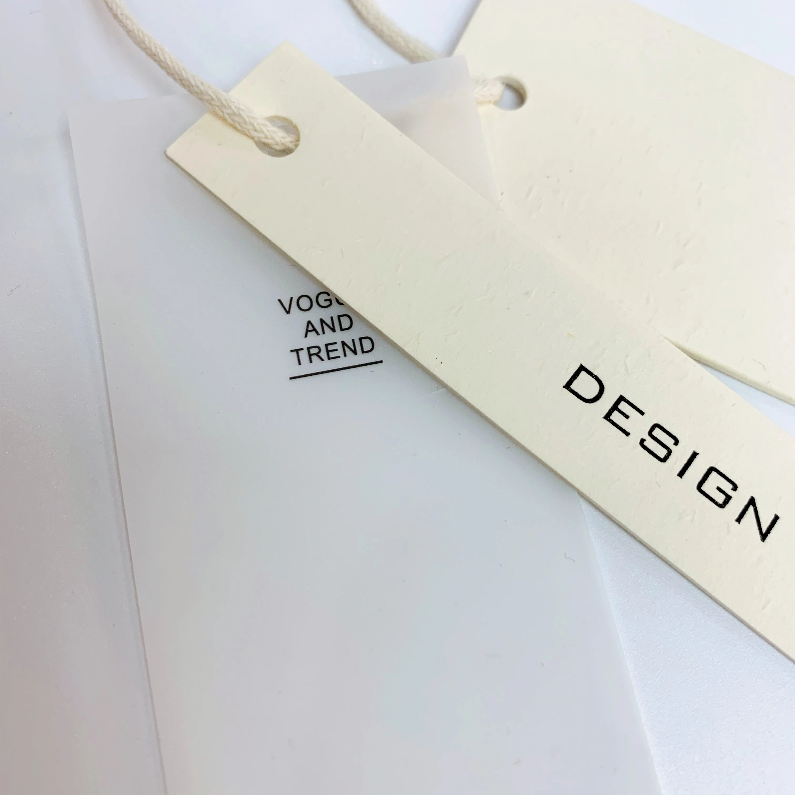 Custom clothing paper swing hanging tags lables translucent embossed pvc luxury printed logo garment hang tag with sting