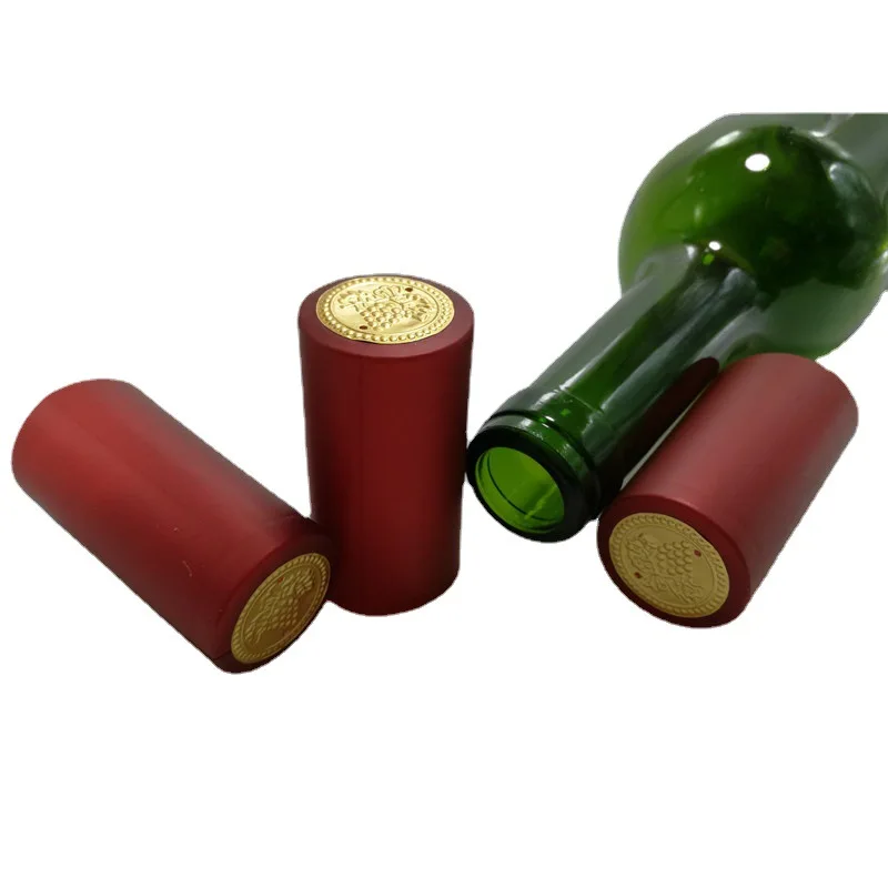 customized logo embossed champagne pvc embossed grape wine bottle aluminum foil sleeves pvc heat shrink cap