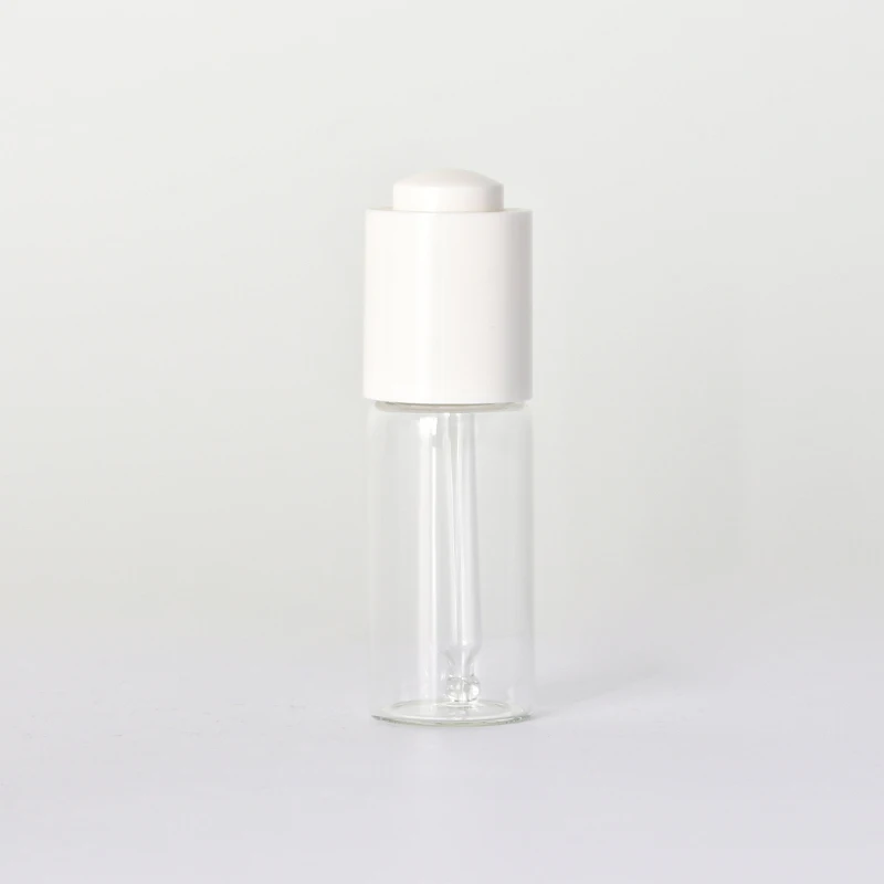 Transparent Skincare Packaging Glass Essential Oil Bottle with White Pressing Dropper