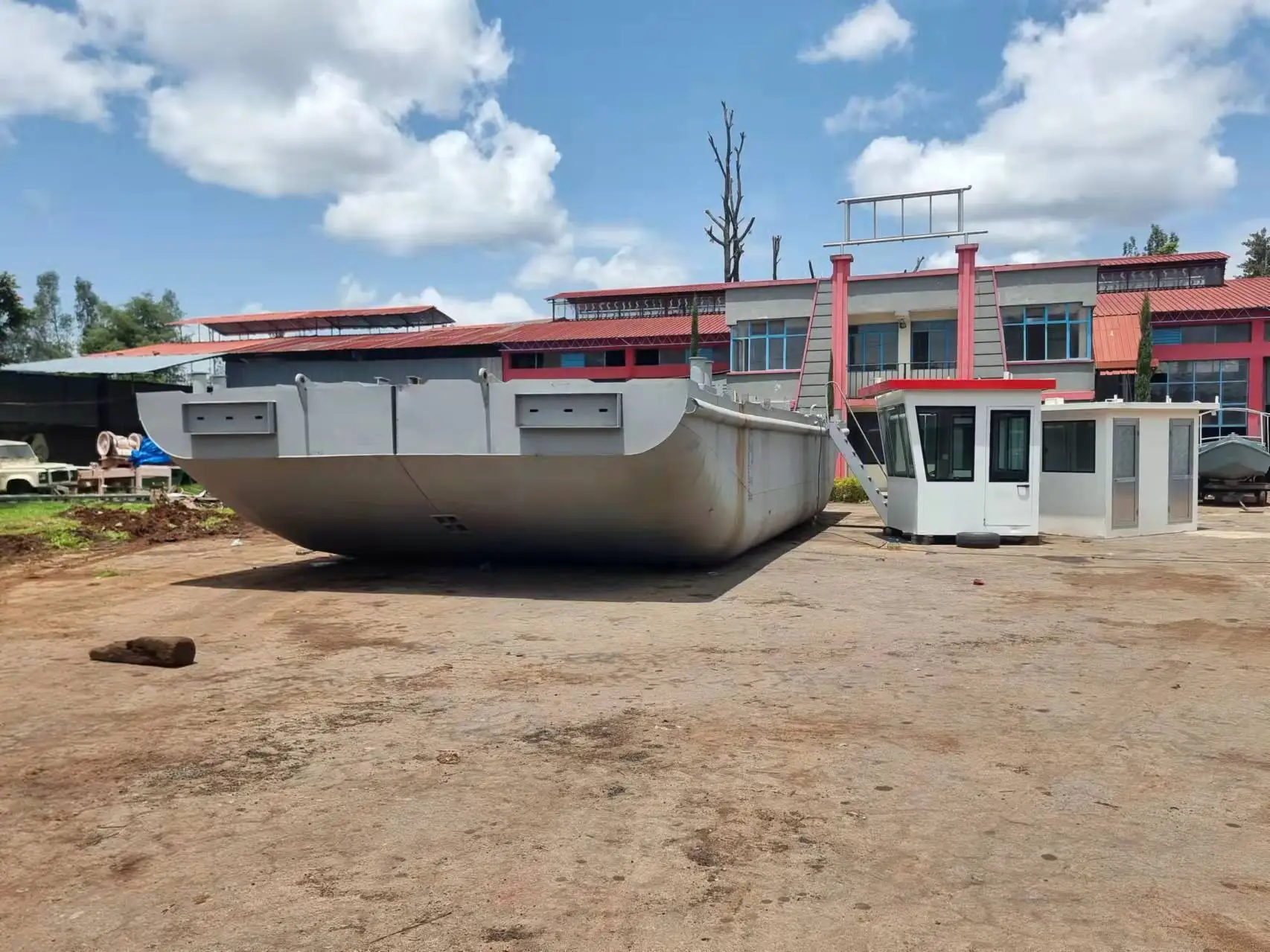 Lake construction project work boat with crane and implements tools