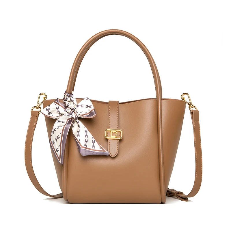 Fashion temperament cowhide female leather niche business hand bucket bag 2022 new one shoulder crossbody bag