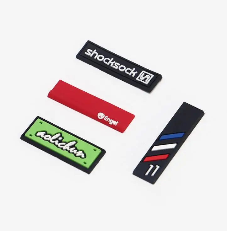 customized brand name labels Rubber badge embossed rubber heat transfer 3d bag labels heat seal labels