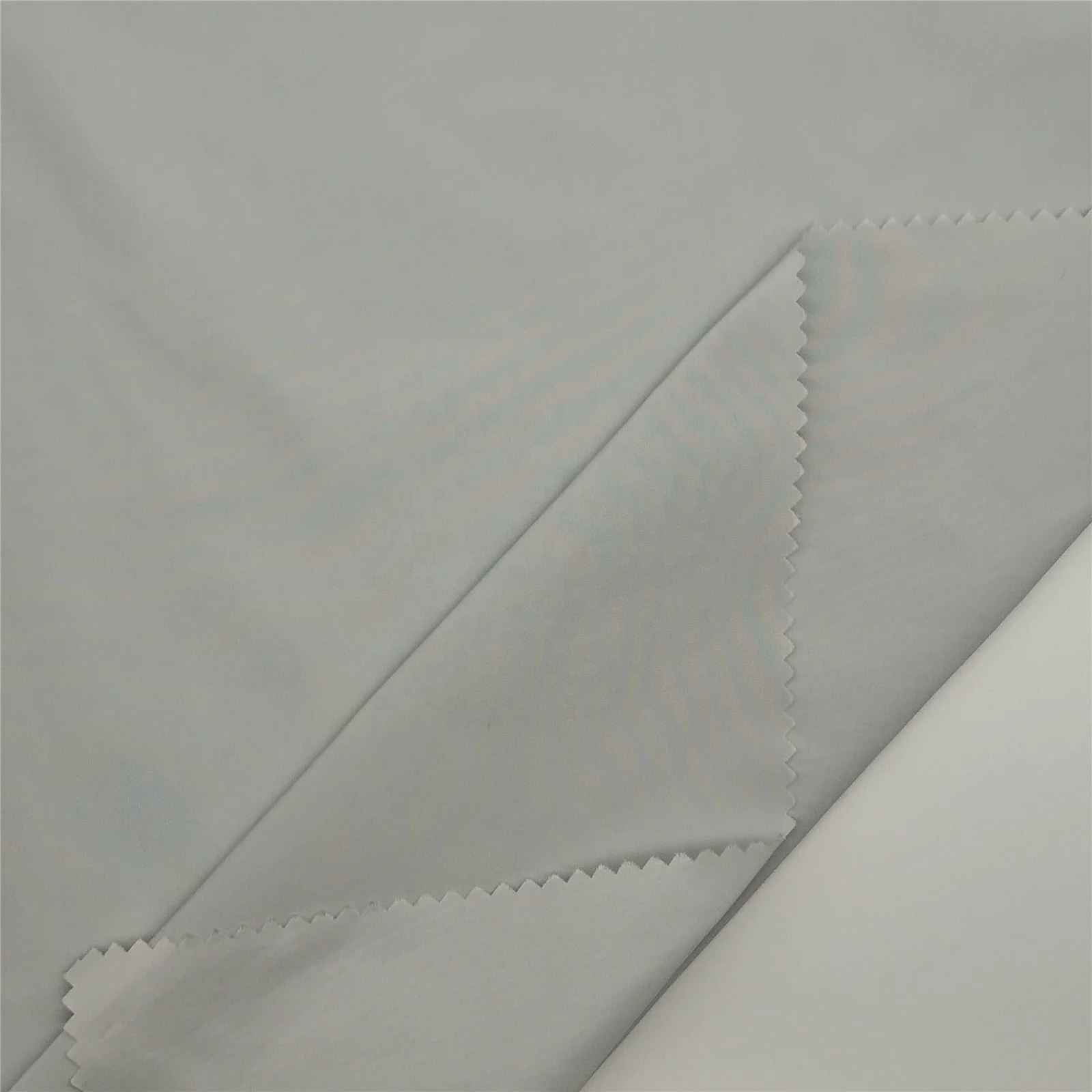 
Dyeing fabric Semi stretch semi real memory fabric 100%Polyester fabric for duck down garments 