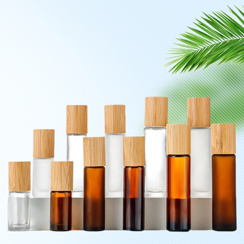 Hot sale 5ml 10ml 15ml bamboo lid Essential Oil Bottle Empty Frosted Glass Roll On Perfume Bottle With Steel roller ball