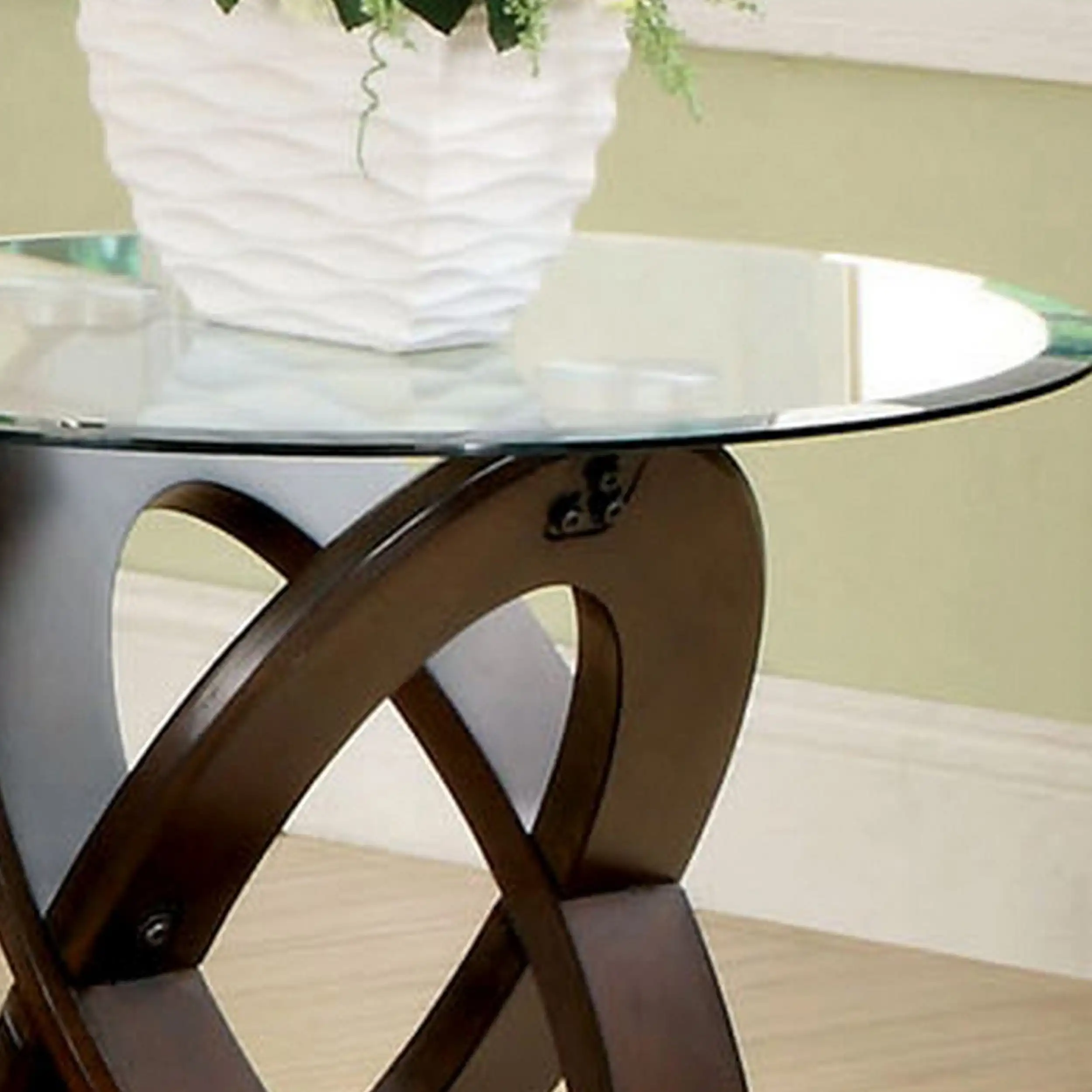A contemporary Chinese side table with brown crossed oval wooden legs fits any balcony or living room space