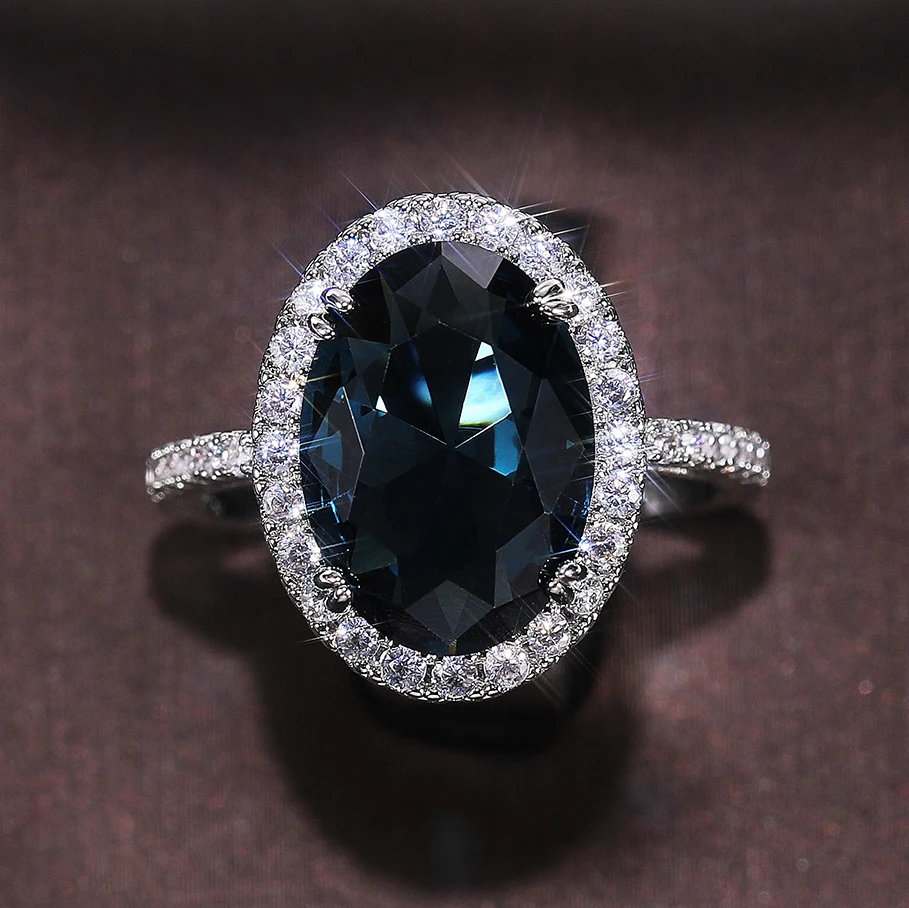 Huitan Customized Noble Hollow Anillos Woman Super Large Oval Pure Royal Blue Gemstone Macro Pave Zircon Luxury Silver Rings