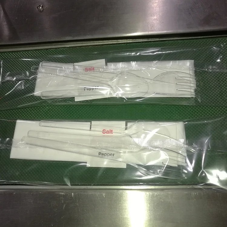 Automatic wet tissue napkin fork spoon cutlery packing machine manufacturer