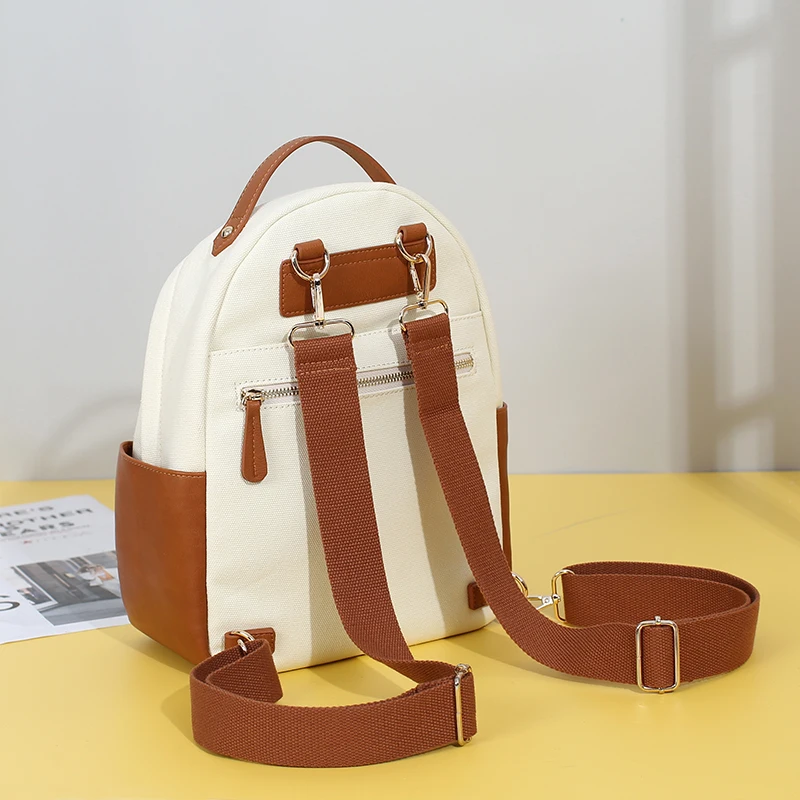Mini canvas and vegan leather diaper bags multifunction baby bags including changing mat and stroller straps