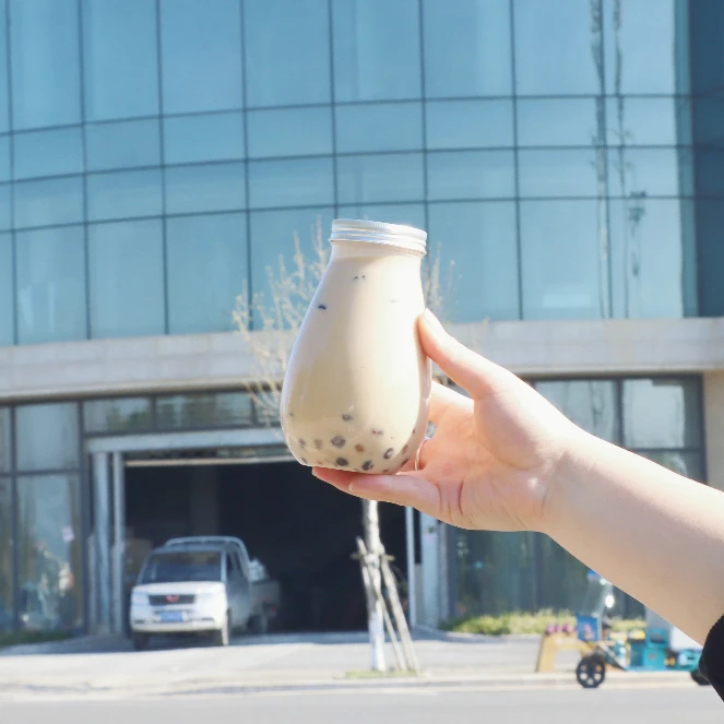 Factory direct 450ml water drop bottle, PET food-grade material, aluminum cover, and customized packaging.