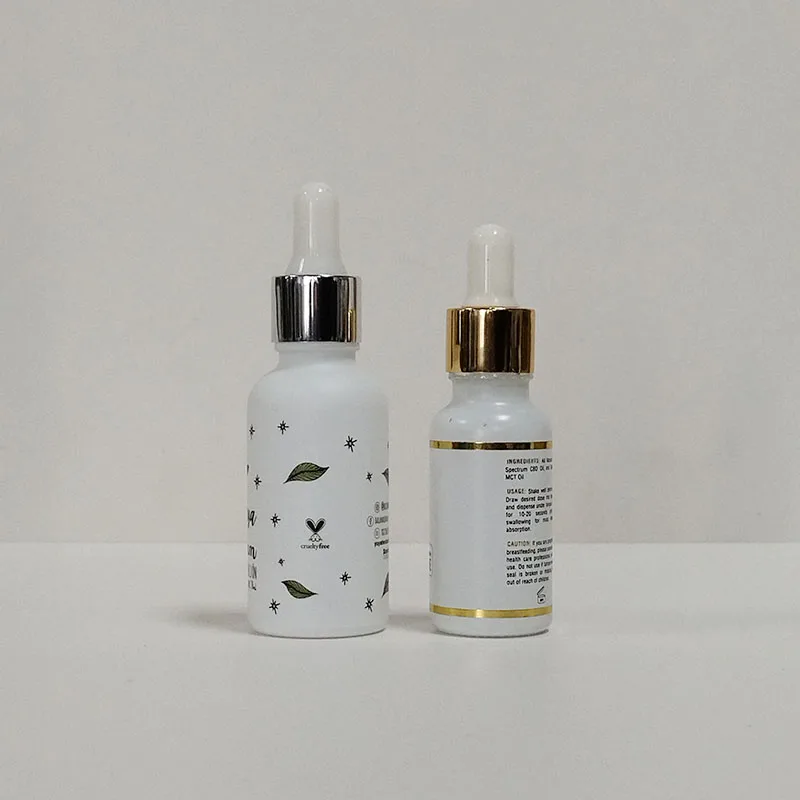 Hot sale luxury custom 10Ml 30ml frosted matte white cosmetic glass serum essential oil bottle with gold dropper and paper tube