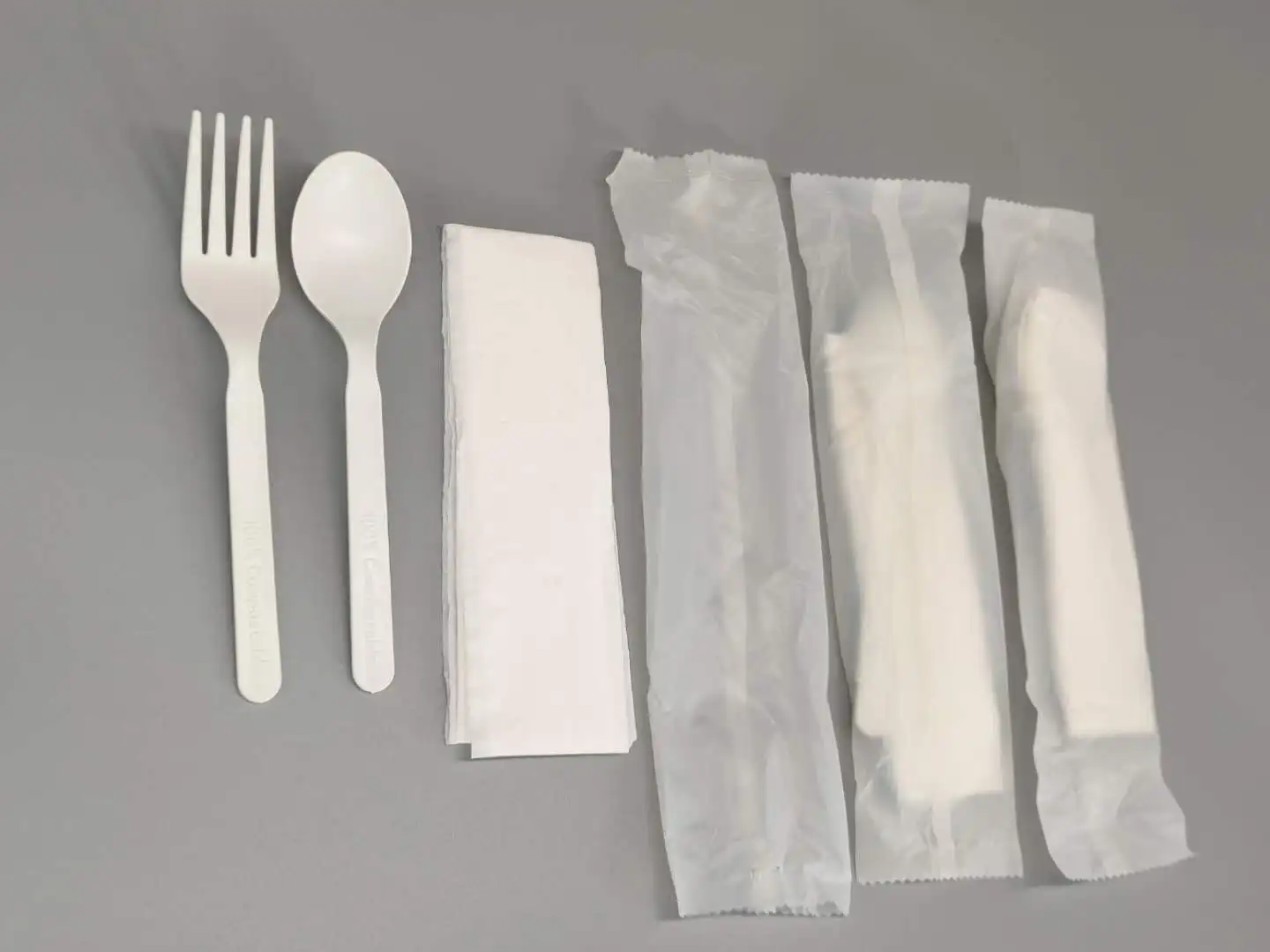 
GreenWorks degradable eco-friendly cutlery with Napkin ,white or black CPLA plastic fork and spoon dinnerware sets 