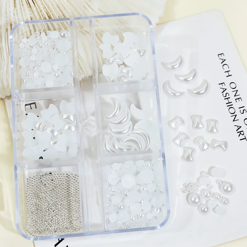 Nail art accessories with a mix of flat-bottomed pearls steel beads moon and bow decorations packaged for 3D nail embellishments