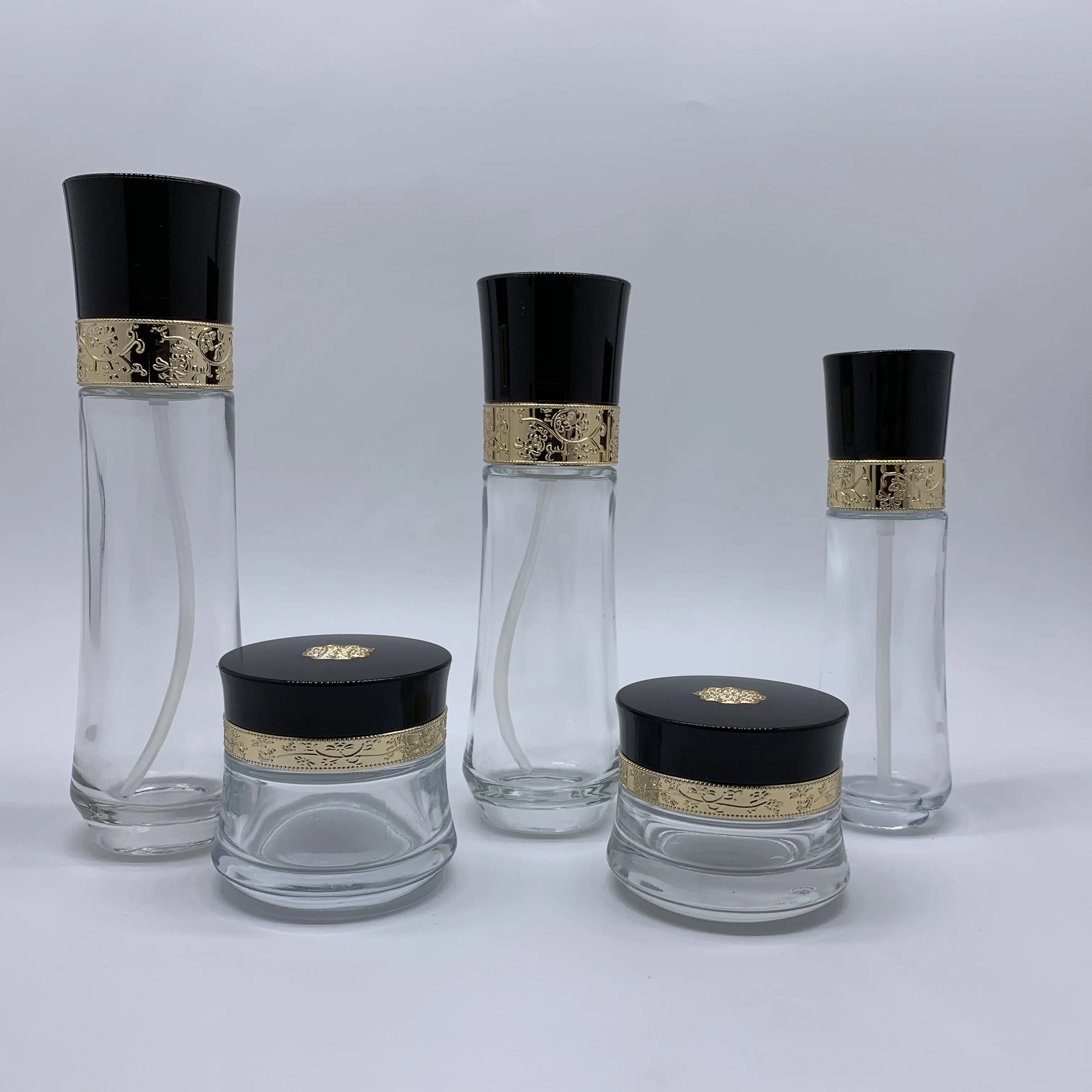 Luxury packaging transparent empty cosmetic sets glass bottle with pump