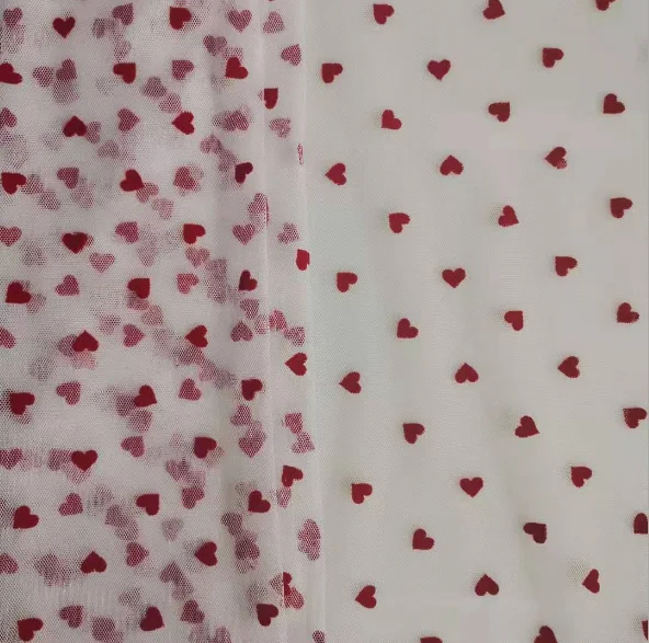 China manufacturer high quality fancy design soft tulle heart flocked mesh fabric for dress