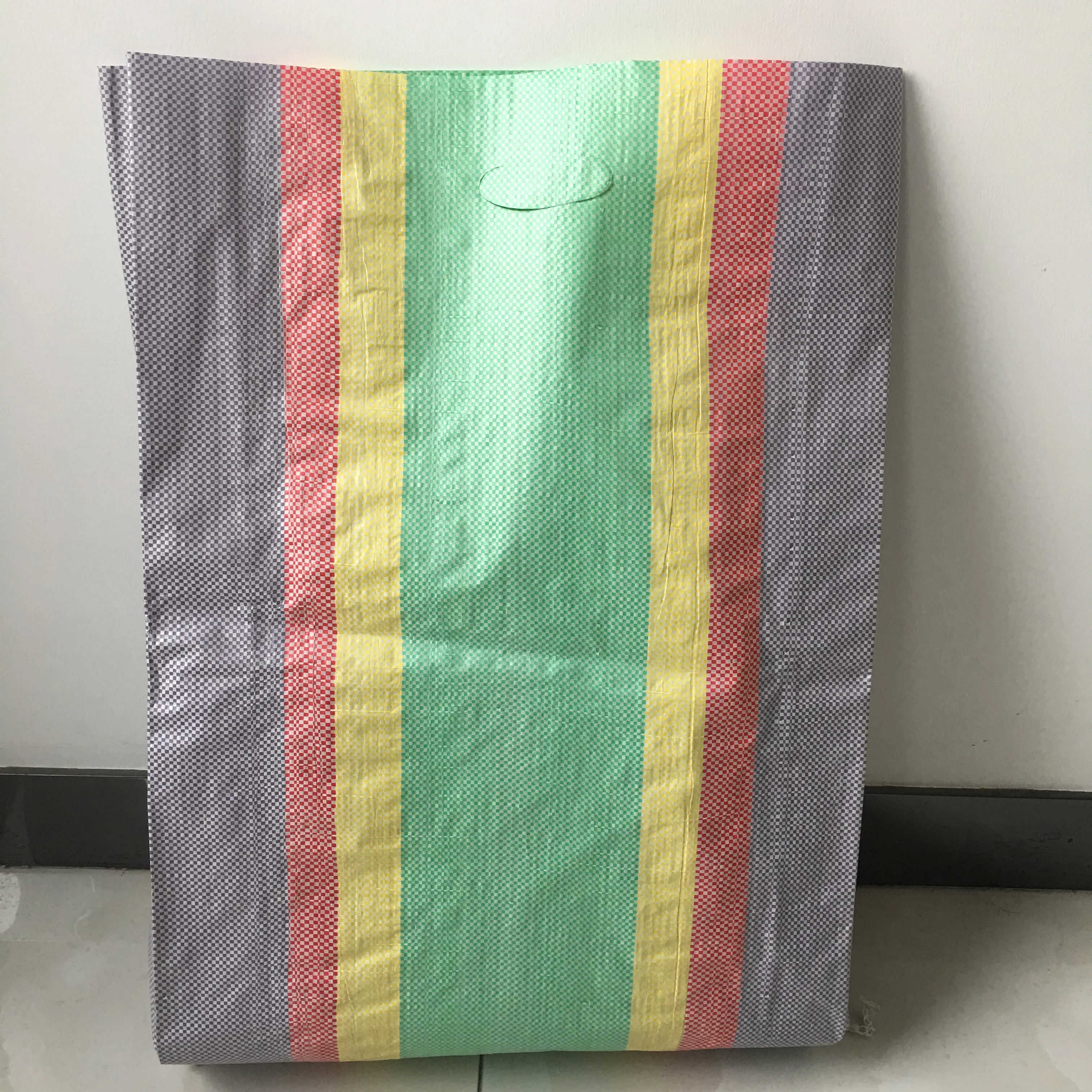 Peru foldable reusable colorful strip laminated pp woven punching handle shopping bag with custom logo and size