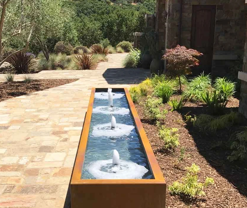 metal wall of water fountain with light steel trough water feature corten steel rain curtain water feature