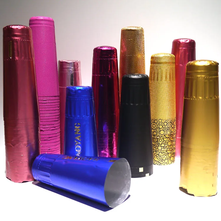 Hot sale Customized Embossed Foil PVC Champagne Bottle Shrink Capsule Sparkling Wine Hood with Custom Tear line Logo 34*120mm