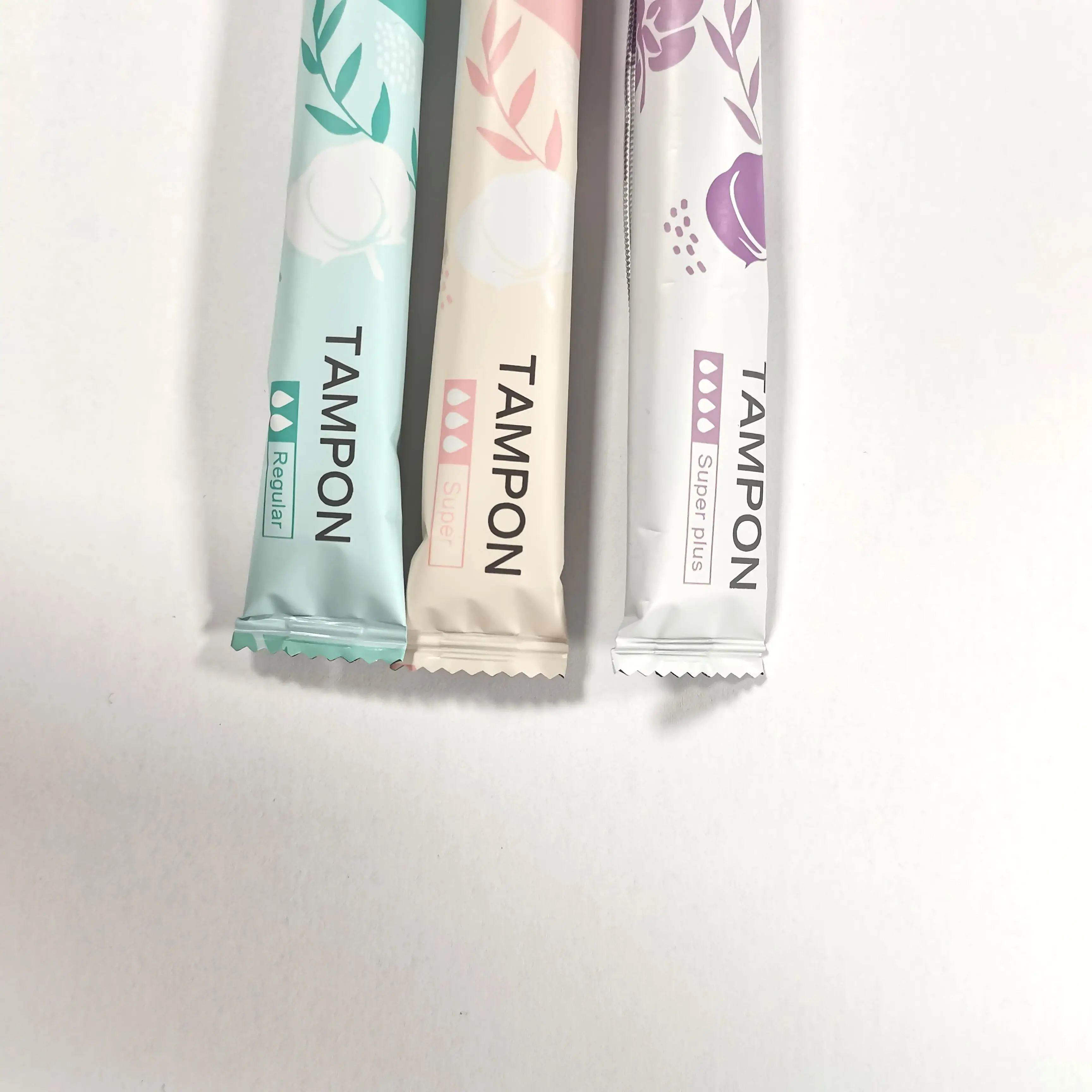 Disposable cotton tampons with plastic applicator