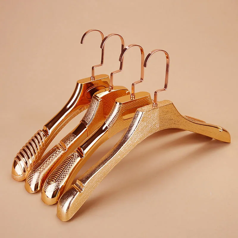 High end electroplated plastic hangers and pants clips, hanging suit hangers in clothing stores