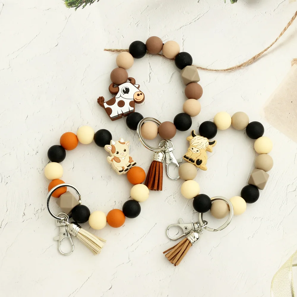 New Creative Cartoon Cow Elk Butterfly Wristlet Tassel Keychain For Girls Silicone Beads Bracelet Keychain Bag Pendant