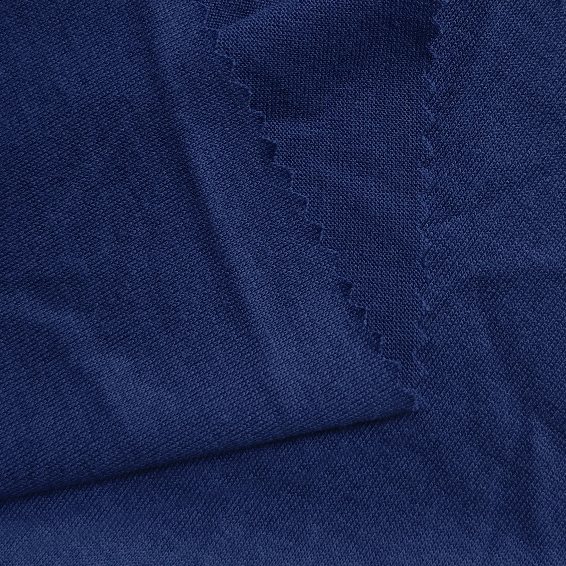 Custom Soft Breathable 100% Spun Polyester Imitation Cotton Single Jersey Fabric For Sports T-shirts