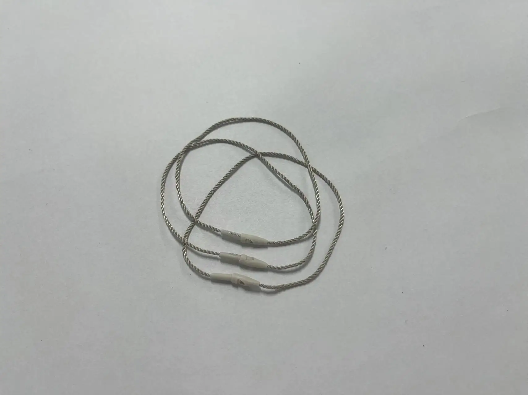 Hot Sale Light Brown Plastic Hang Tag String Lock String Stopper for Clothing