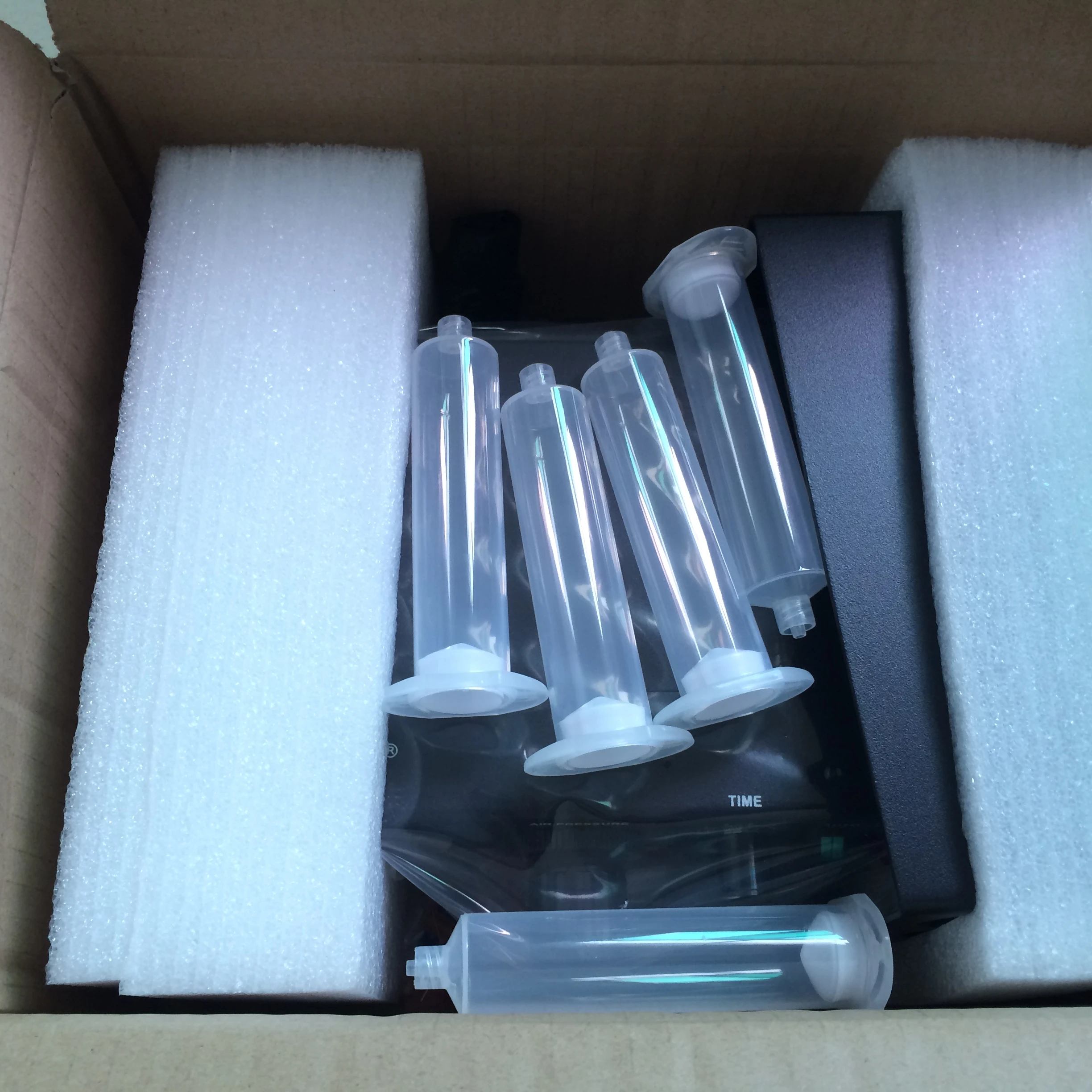 Glue dispenser Adhesive Machine Is Used for Gluing Medicine Boxes Diapers and Express Bags Case Mexico Russia Romania Egypt