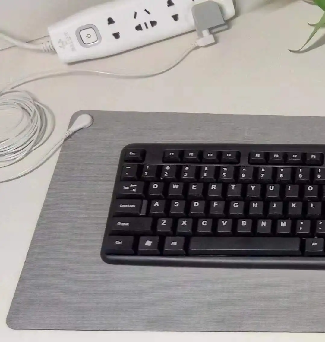 Grounding keyboard mouse pad