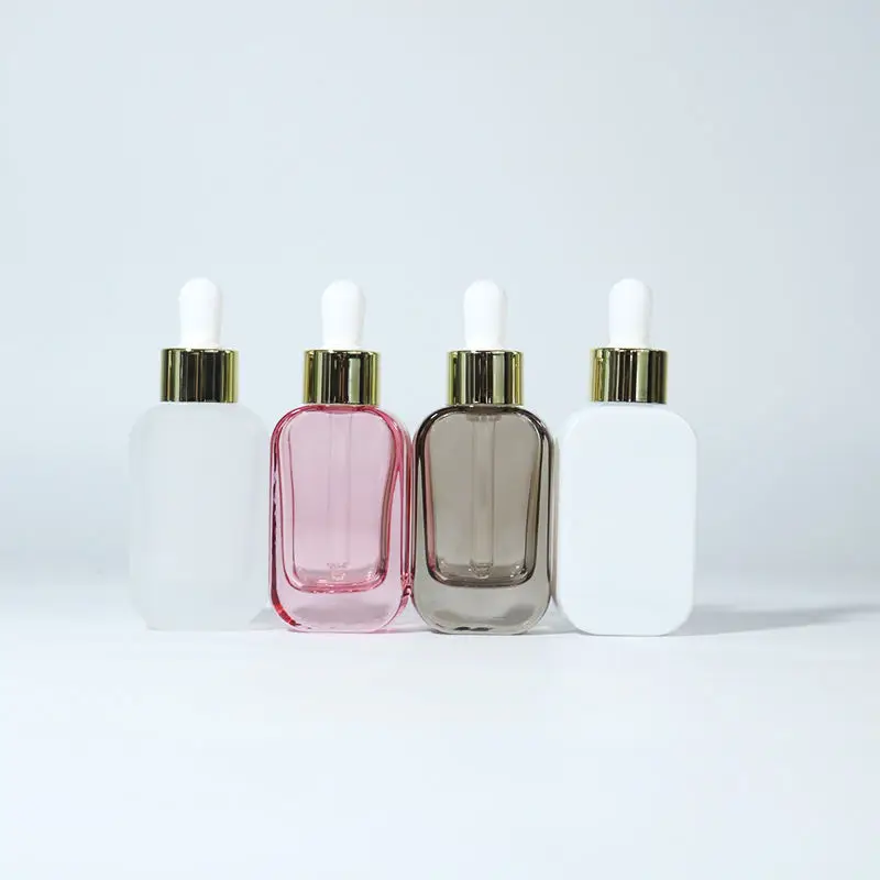 Cosmetic Packaging Fancy Essential Oil 35ml Round Clear Glass Dropper Bottles With Rose Gold Dropper