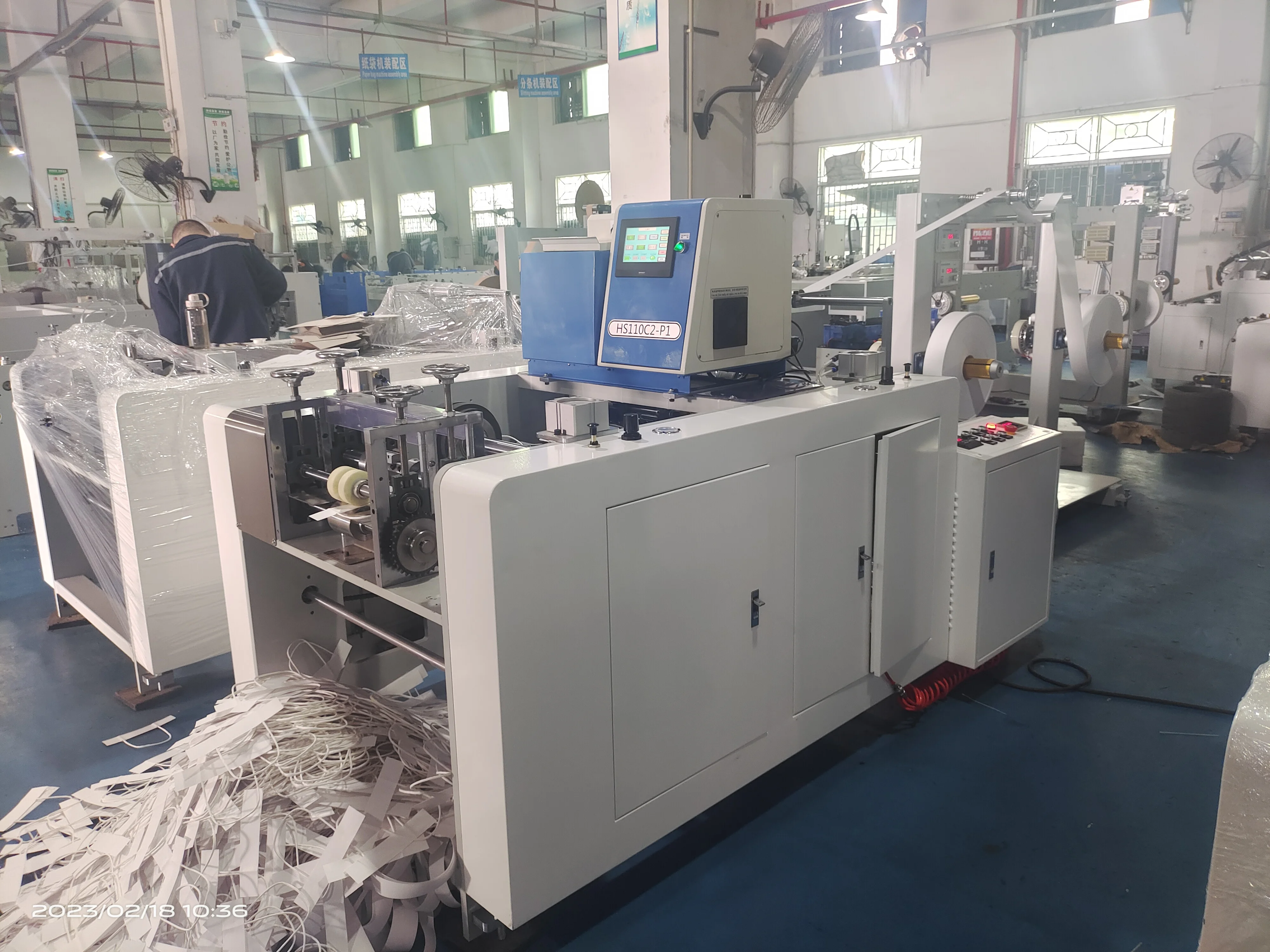 Hot melt glue paper bag handle making machine in China for sale