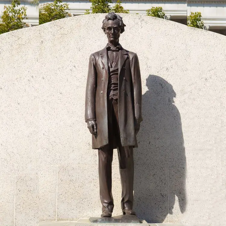 Bronze figure and goats sculpture statue on a square after rain next to cafe London in United Kingdom