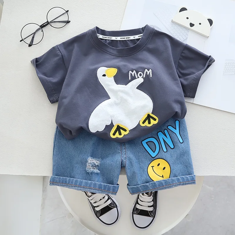 Clothing factory wholesale 2024 high quality fashion cartoon printed round neck children short sleeve and shorts two sets