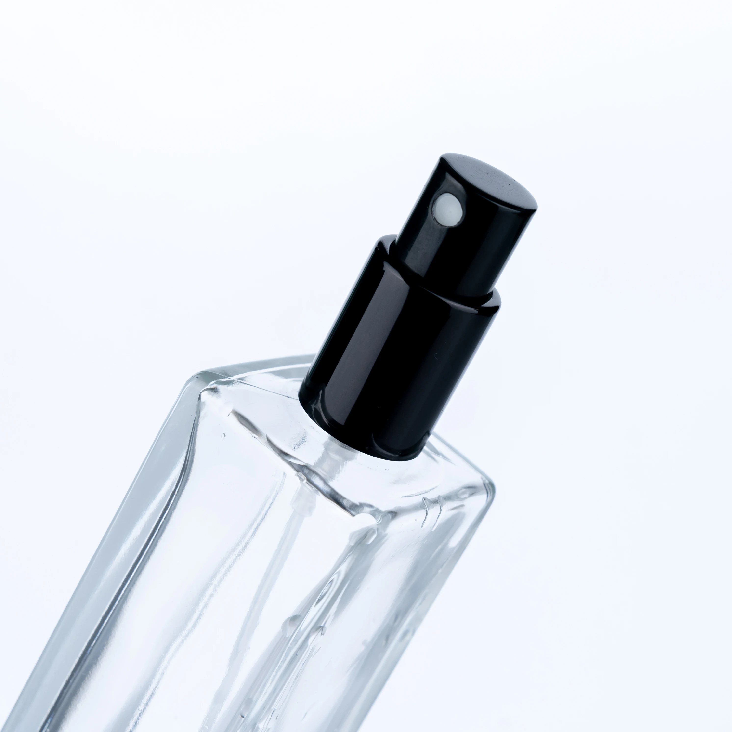 
The Customized High Quality 100ml Transparent Bottle With Black Round Cap Square Tall Perfume Bottle 
