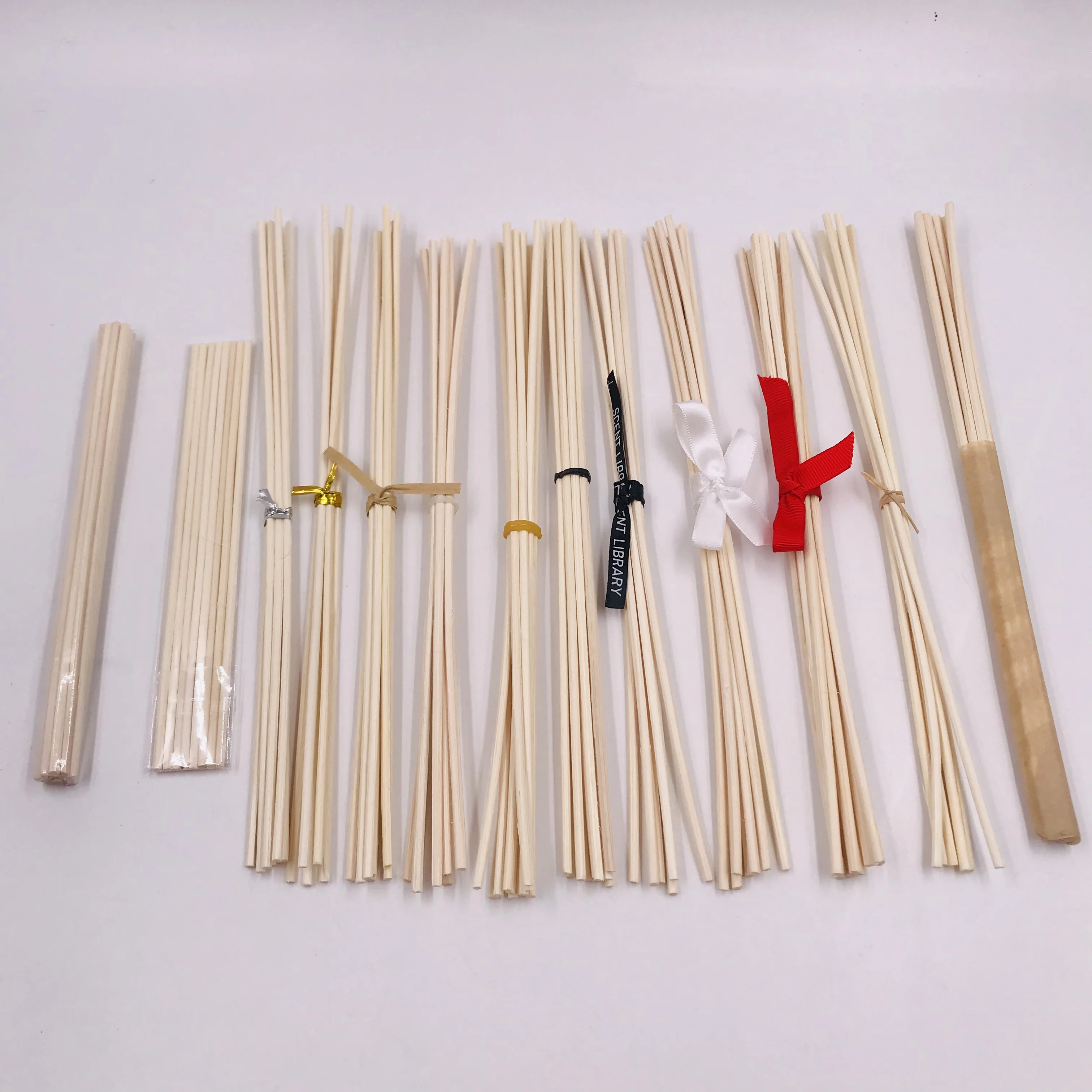 
3*240mm natural rattan diffuser sticks/diffuser reed sticks/rattan reed, 8pcs/pack by elastic rubber 