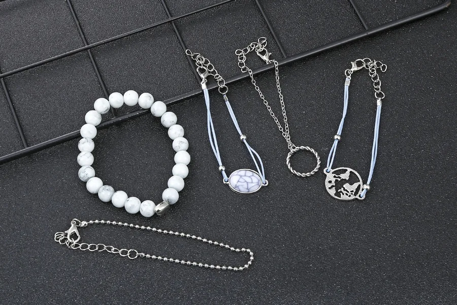 
Korean Fashion Oval crack pine stone bead chain map hollow ring bracelet set of five pieces creative marble hand rope 