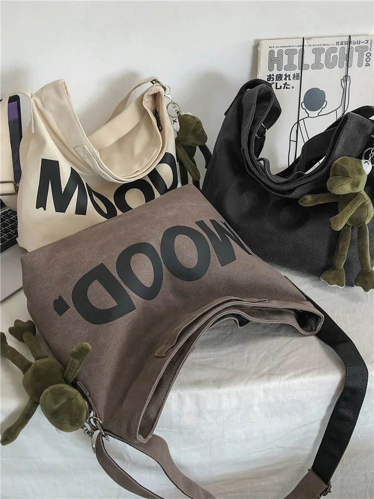 Wholesale custom printed letter shoulder bag large capacity fabric canvas zipper couple tote shoulder bag lazy style