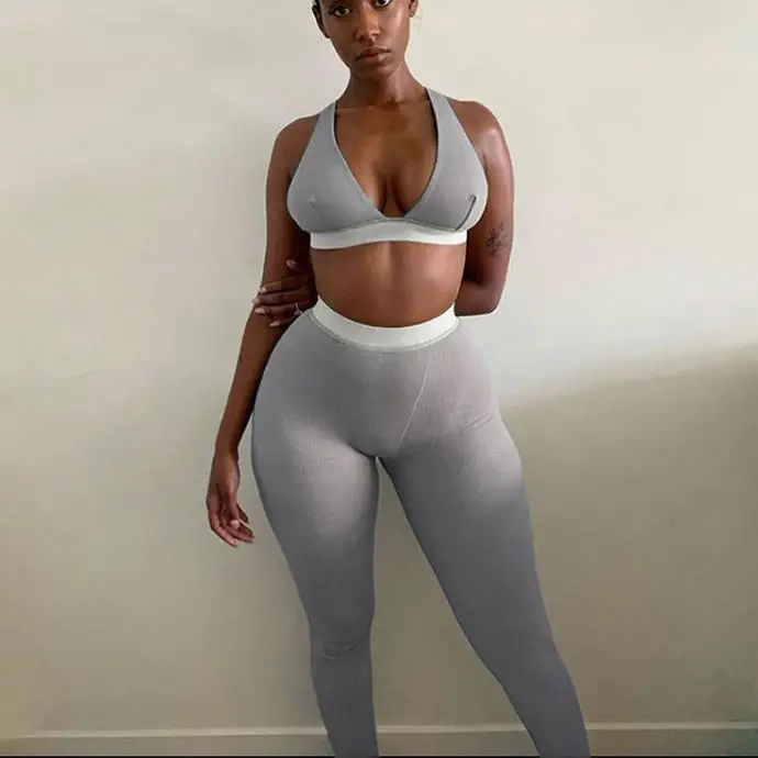 
Plastic fitness sporty women tracksuit stretchy leggings ribbed bra two piece set made in China 