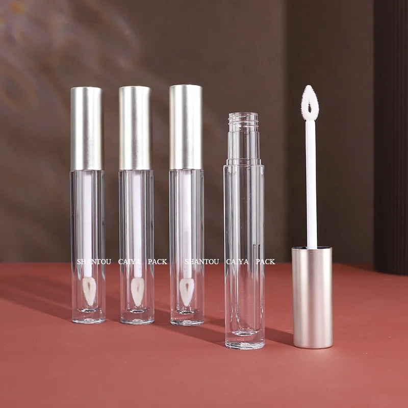 Shantou cosmetic packaging manufacturer wholesale 3ml long neck empty frost black silver round lip gloss balm tube heart brush