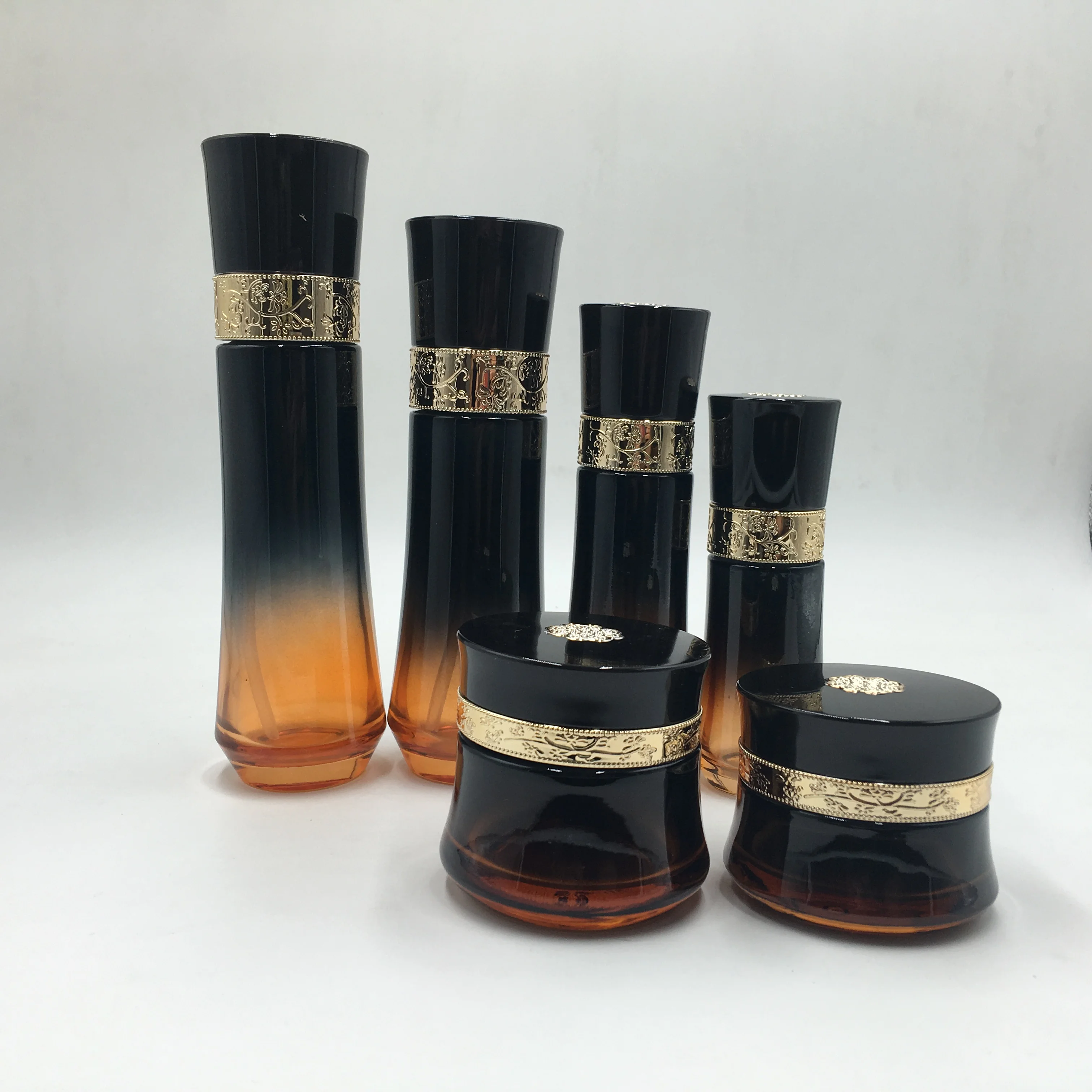 Luxury packaging transparent empty cosmetic sets glass bottle with pump