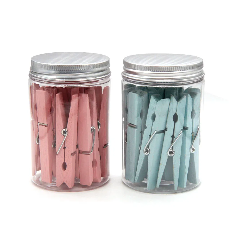 Pink wood clothes peg in plastic jar for office