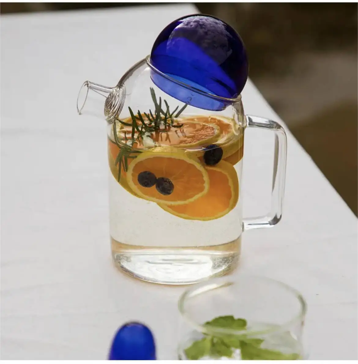 New Creative Design Fashion Glass Pitcher Jug Carafe With 3D Figure Inside And Colored Glass Ball Lid