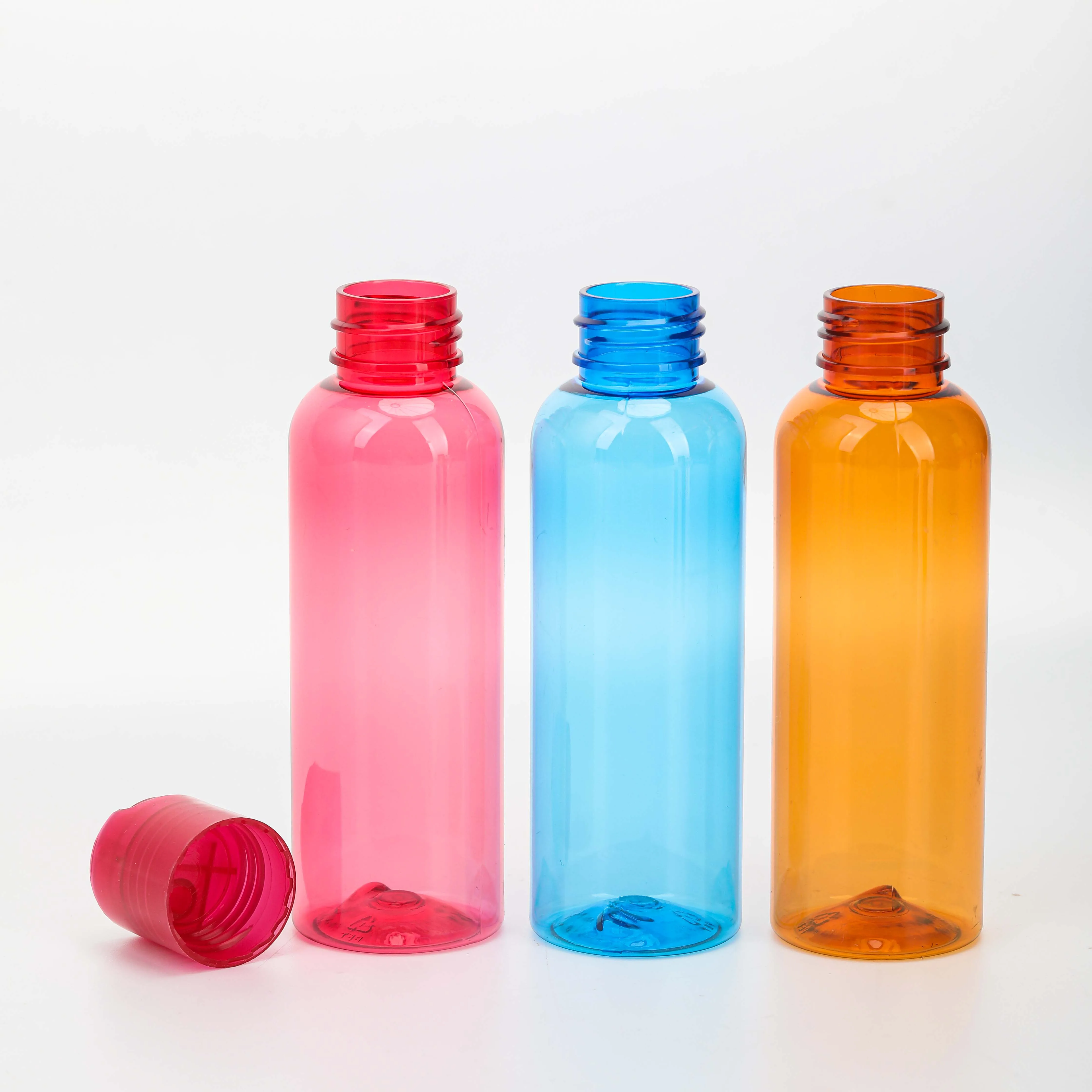 Empty red pink 60ml 120ml 2oz 4oz PET plastic Squeeze Bottles with Press Disc Top for Shampoo Lotion Cream