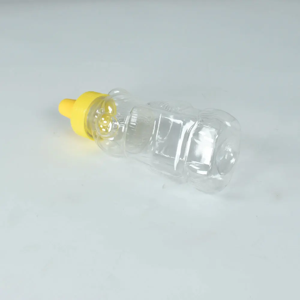 Unique animal bear shape squeeze plastic honey bottle pet material honey jars for sauce plastic container