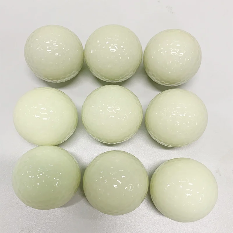 white fluorescent golf ball in golf  balls